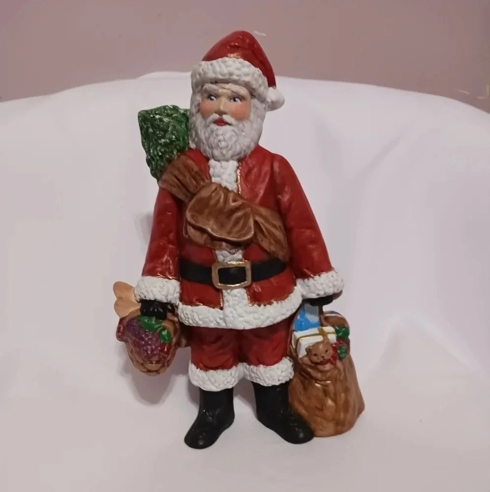 -Santa claus holding fruits basket & his bag of gifts